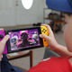 A kid playing a Nintendo Switch